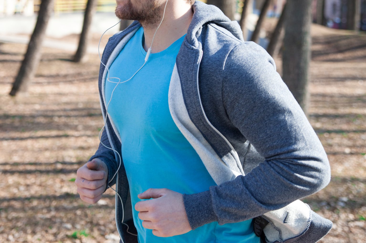 A man jogging listening to headphones